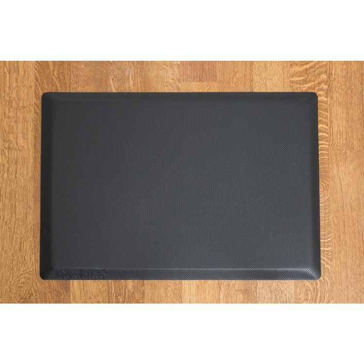 a black rectangular object on a wooden surface