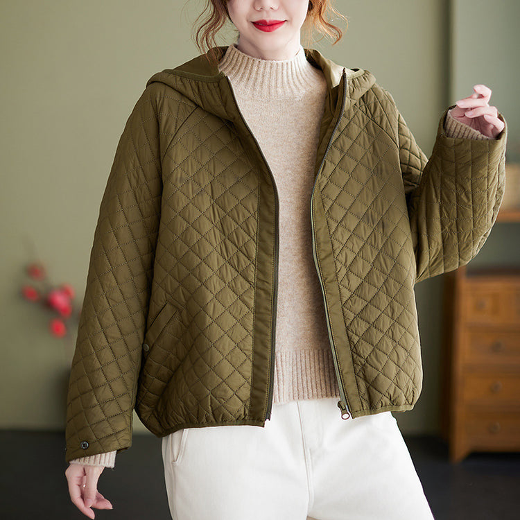 a woman in a green jacket