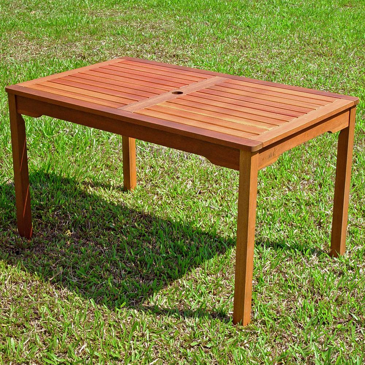 a wooden table on grass
