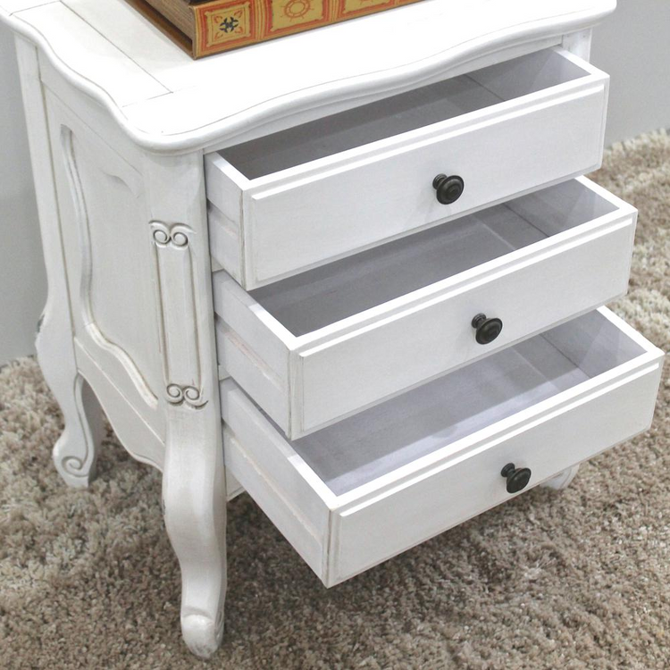 a white dresser with drawers