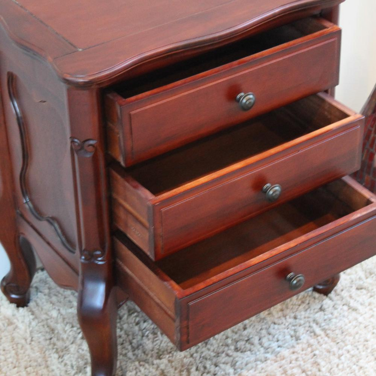a wooden dresser with open drawers