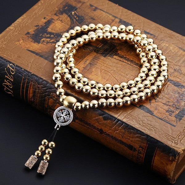 a necklace on a book