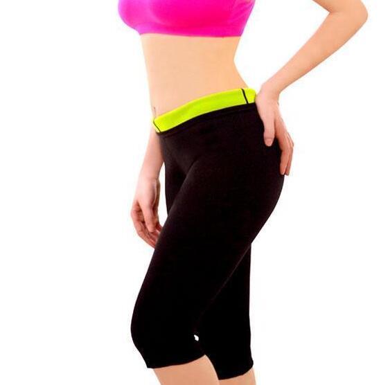 a woman wearing a pink and black sports garment