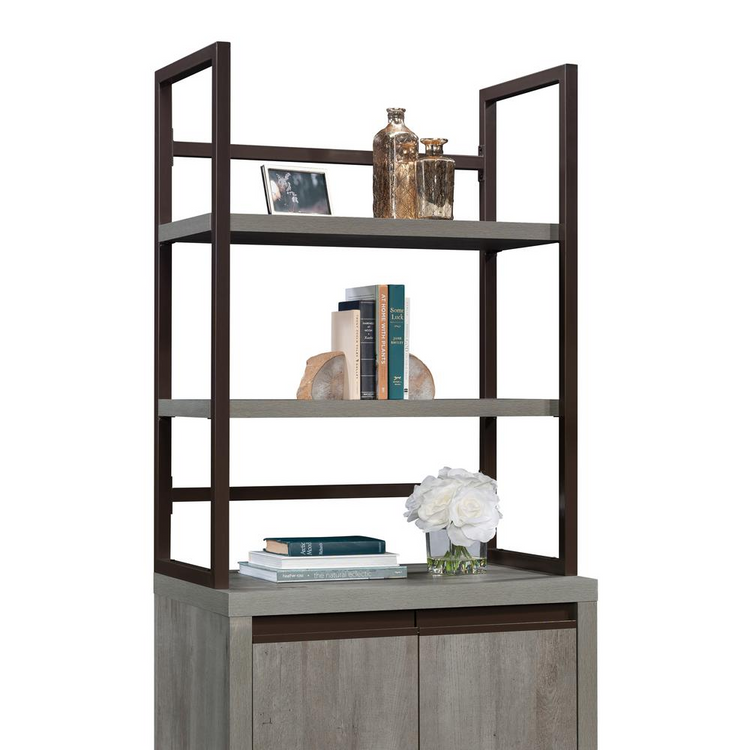 a shelf with books and a flower on it