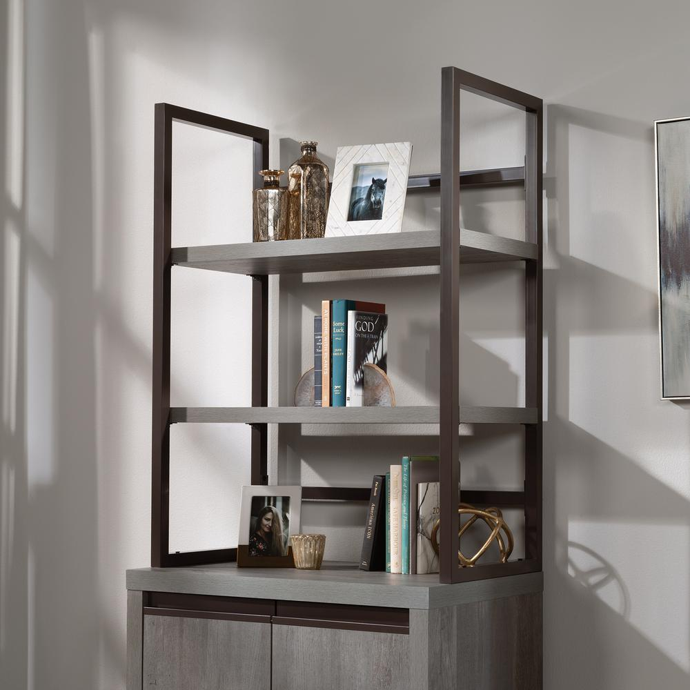 a shelf with books and pictures on it