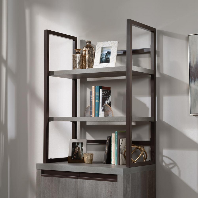 a shelf with books and pictures on it