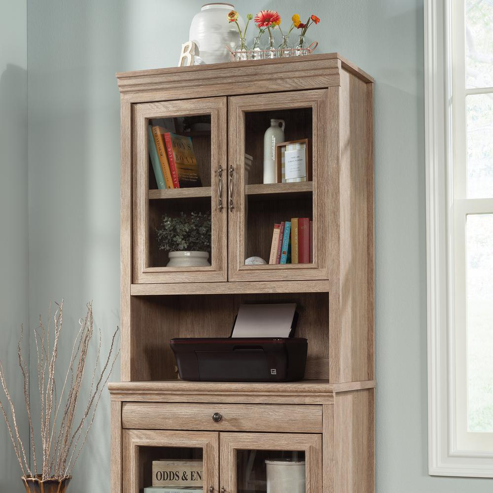 a wooden cabinet with glass doors