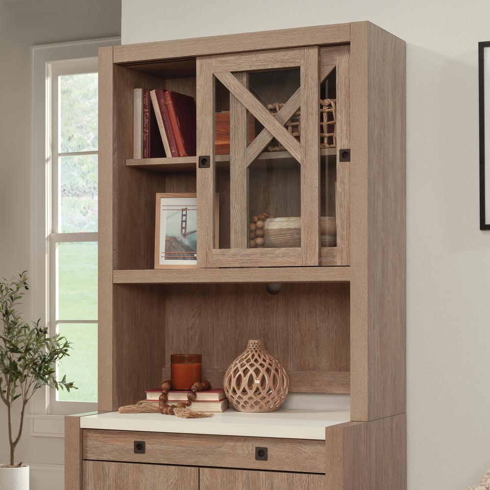 a wooden cabinet with glass doors
