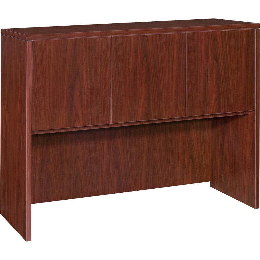 a brown wooden cabinet with three doors