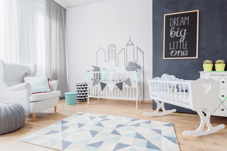 a room with cribs and a rug