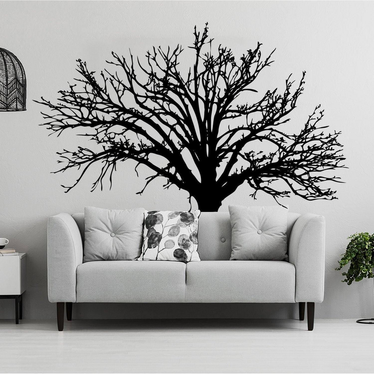 a couch with a tree on the wall