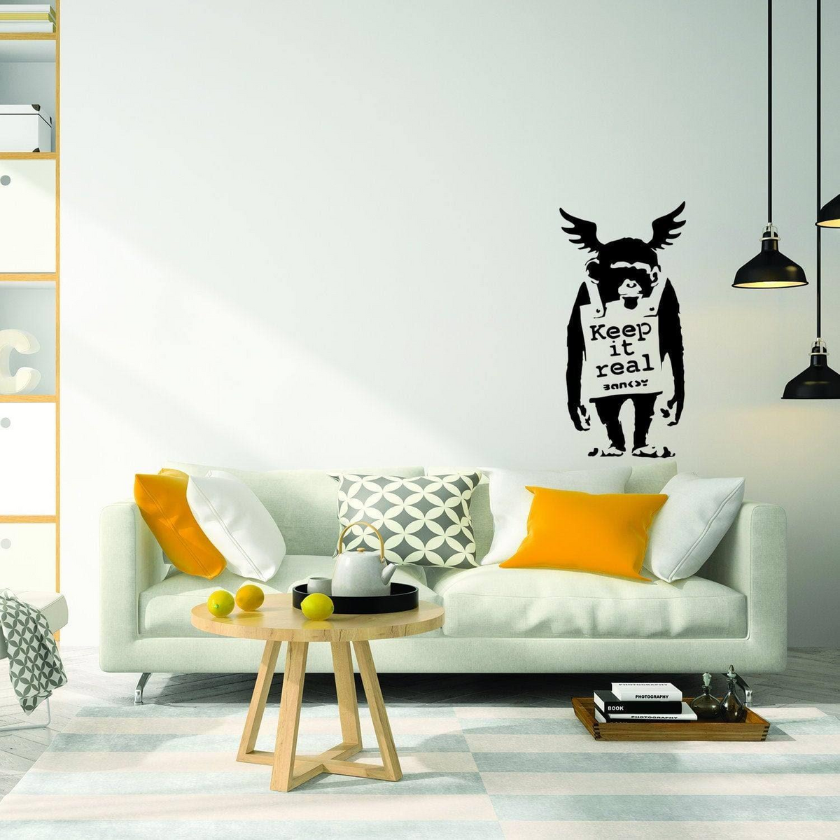a white couch in a room with a coffee table and a black and white wall