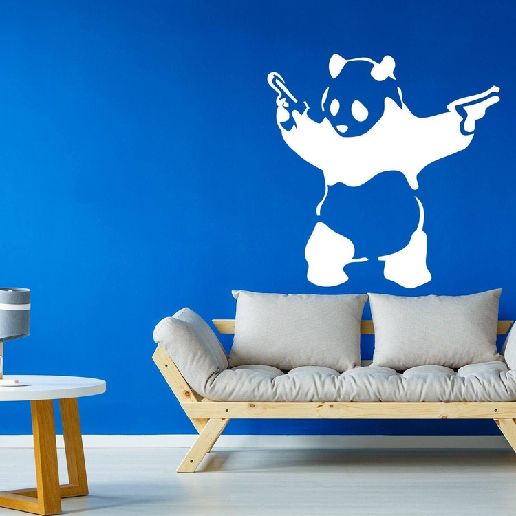 a couch and a wall with a panda on it