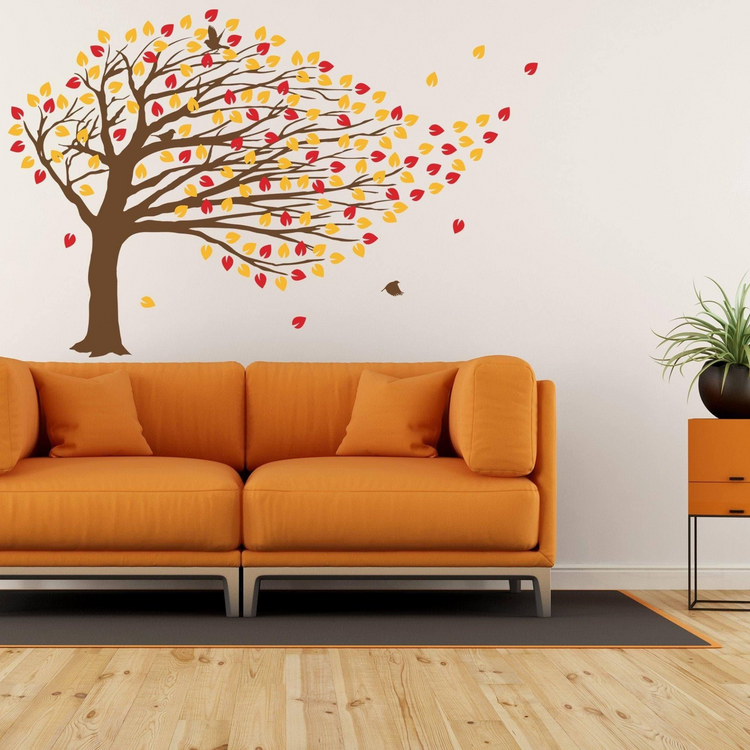 a couch and a tree wall decal