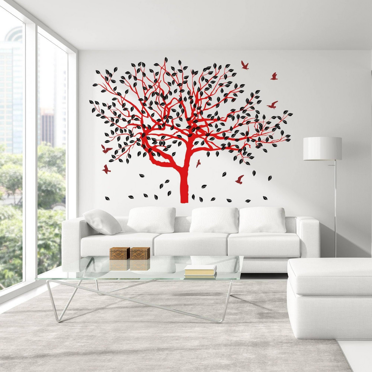 a white couch with red tree decal on wall