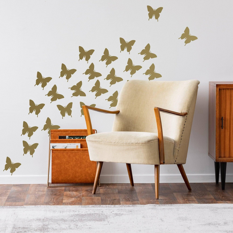 a chair with butterflies decals on a wall