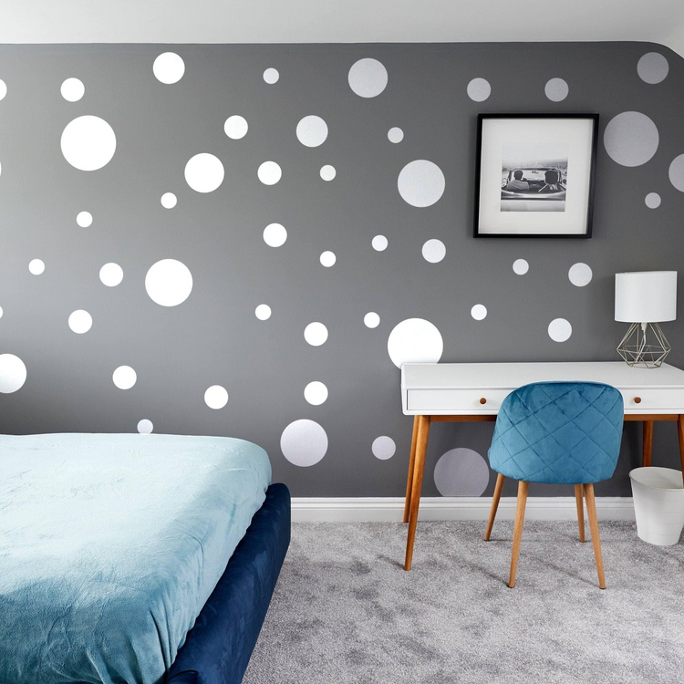a bedroom with a bed and a desk