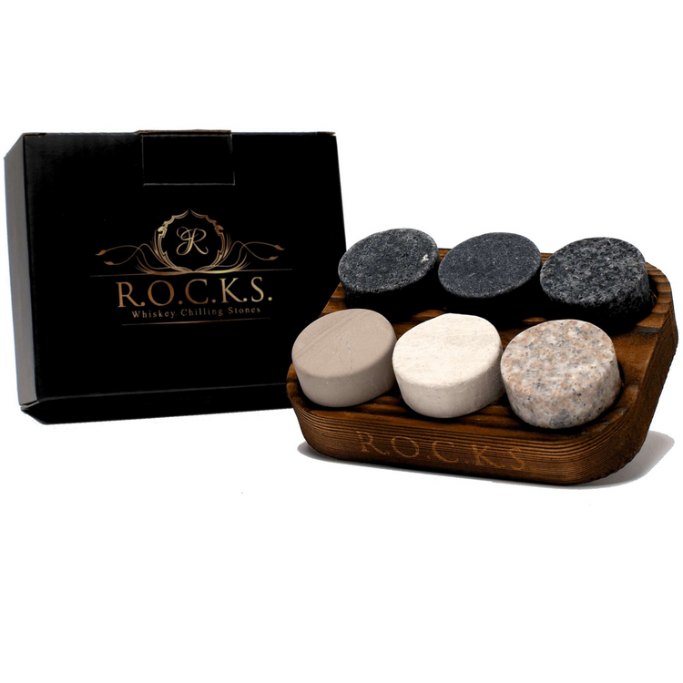 a wooden box with round stones