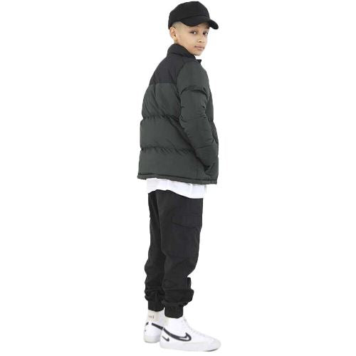 a boy in a black hat and jacket
