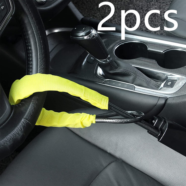 a car steering wheel with a yellow strap attached to it