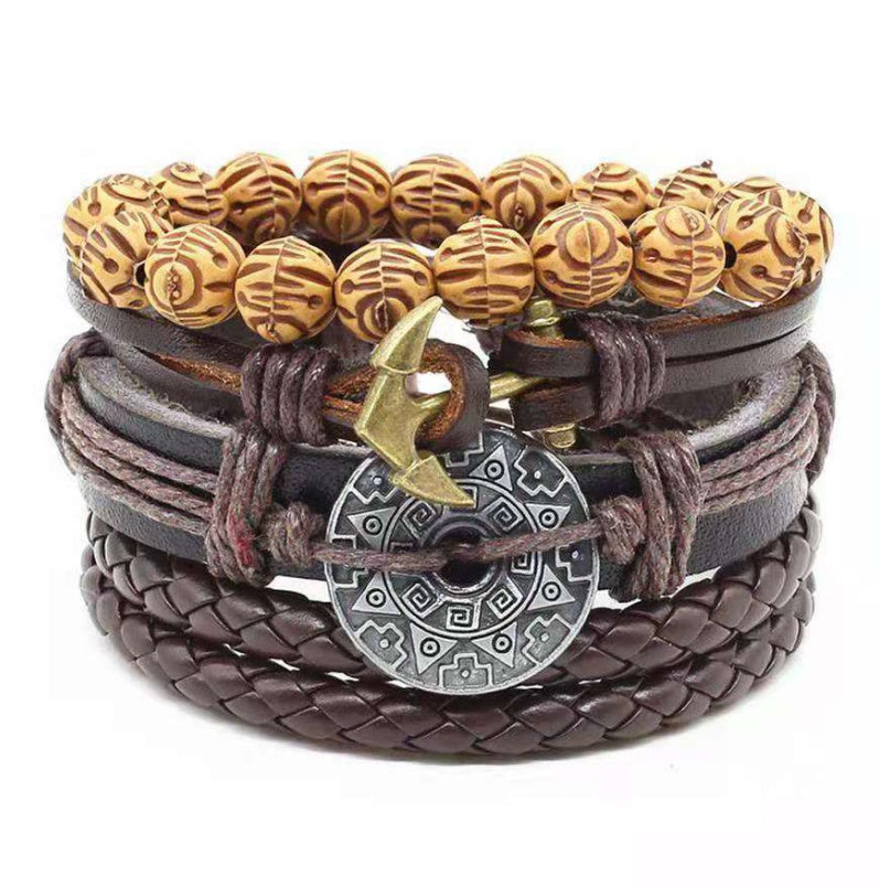a stack of bracelets with a metal and wood bead