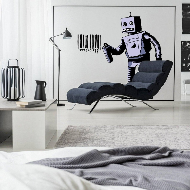 a room with a picture of a robot and a couch