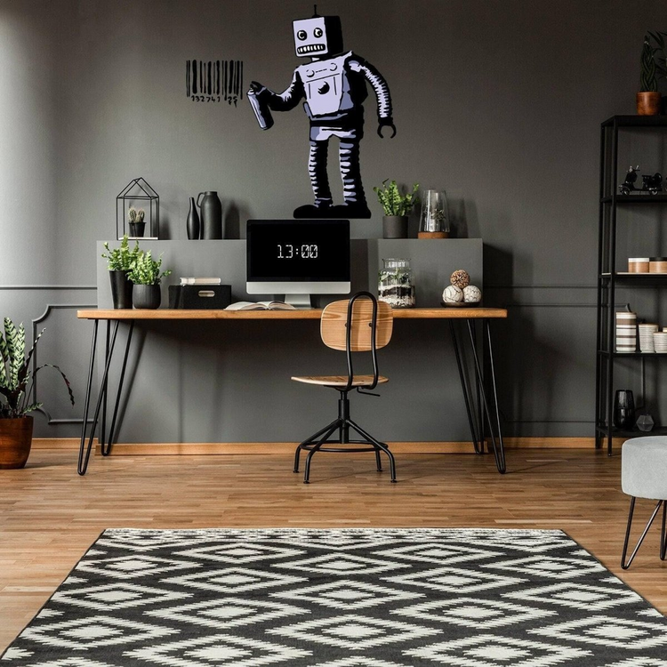 a room with a desk and chair and a computer