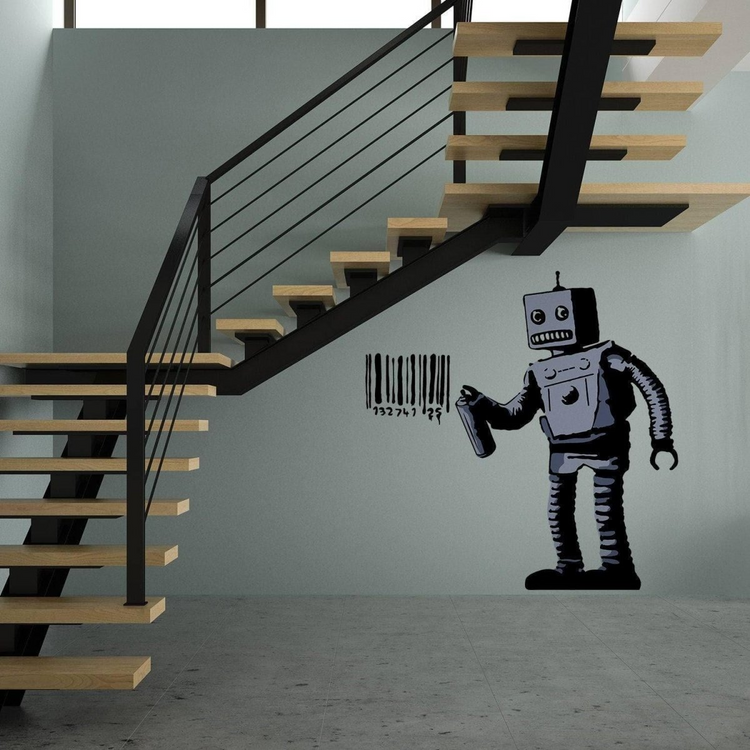 a staircase with a robot painted on the wall