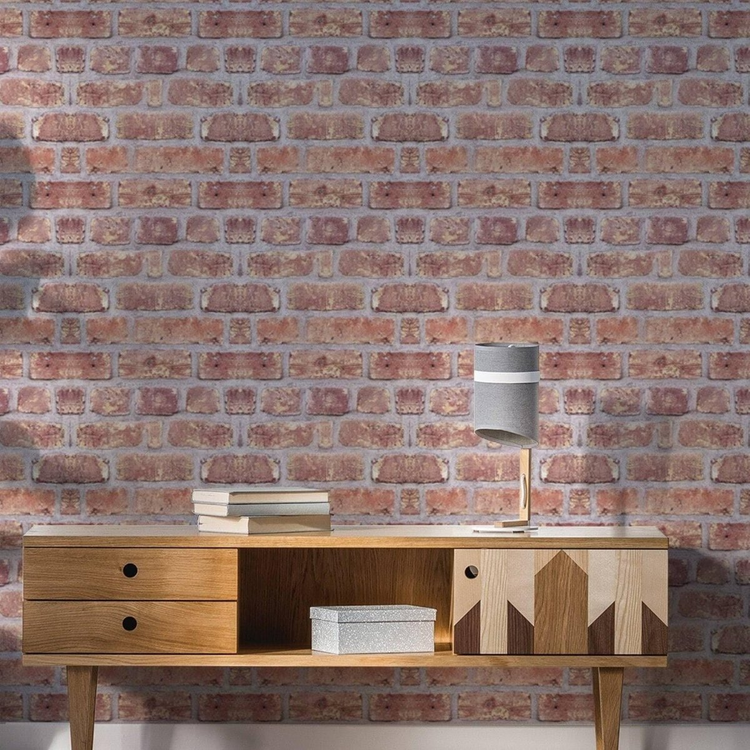 a wooden table with a lamp and books on it