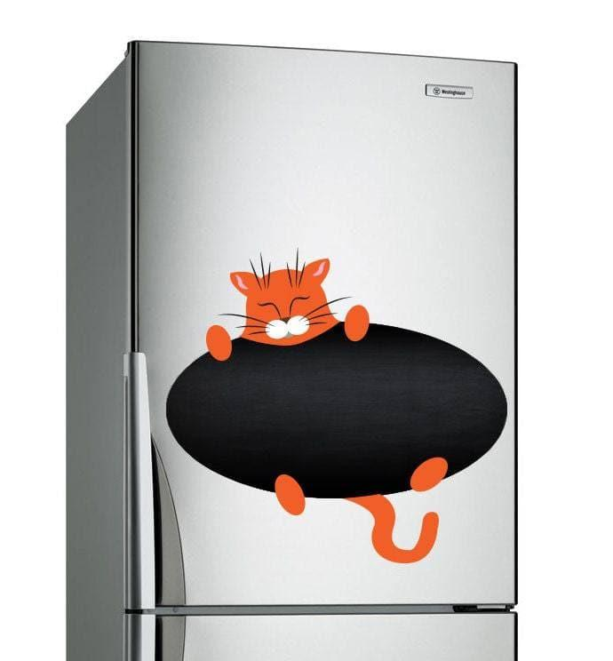a silver refrigerator with a cat on it