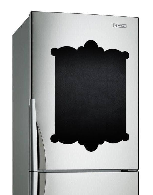 a silver refrigerator with a black board