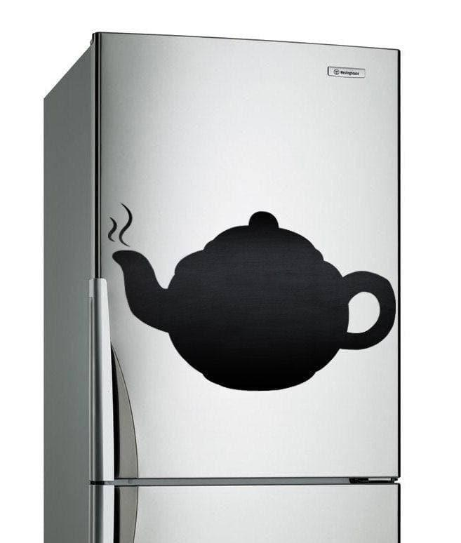 a silver refrigerator with a teapot on it