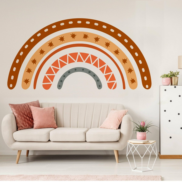 a white couch with a white cabinet and a white couch with a pink and brown rainbow on the wall