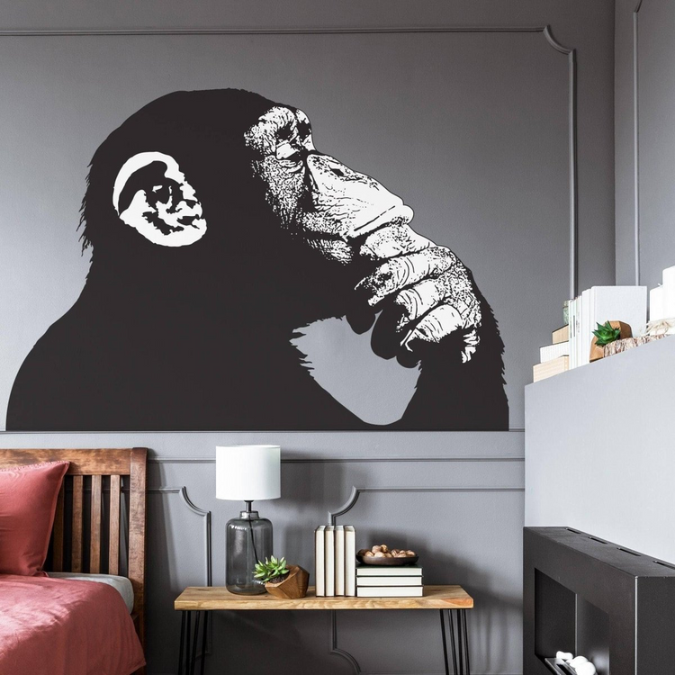 a wall with a picture of a monkey on it