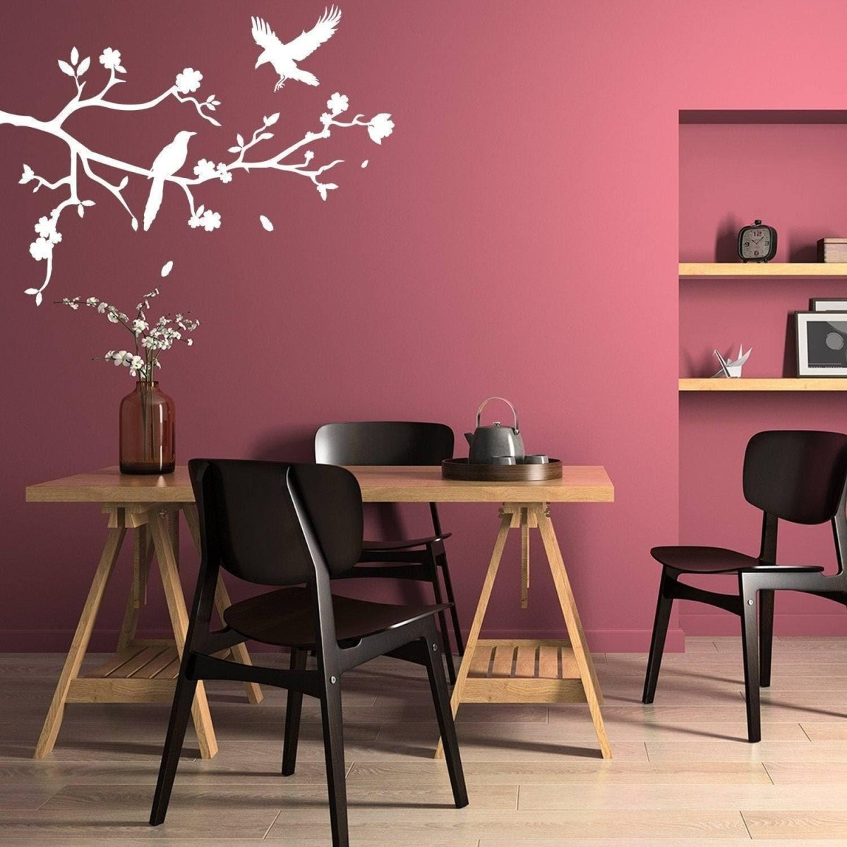 a table with chairs and a vase on it