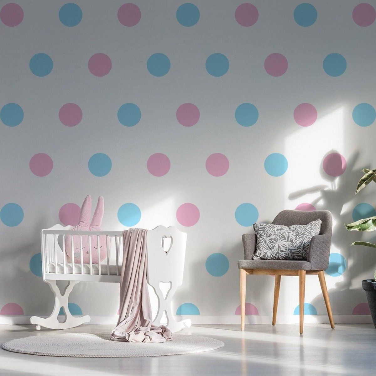a baby room with a crib and chair