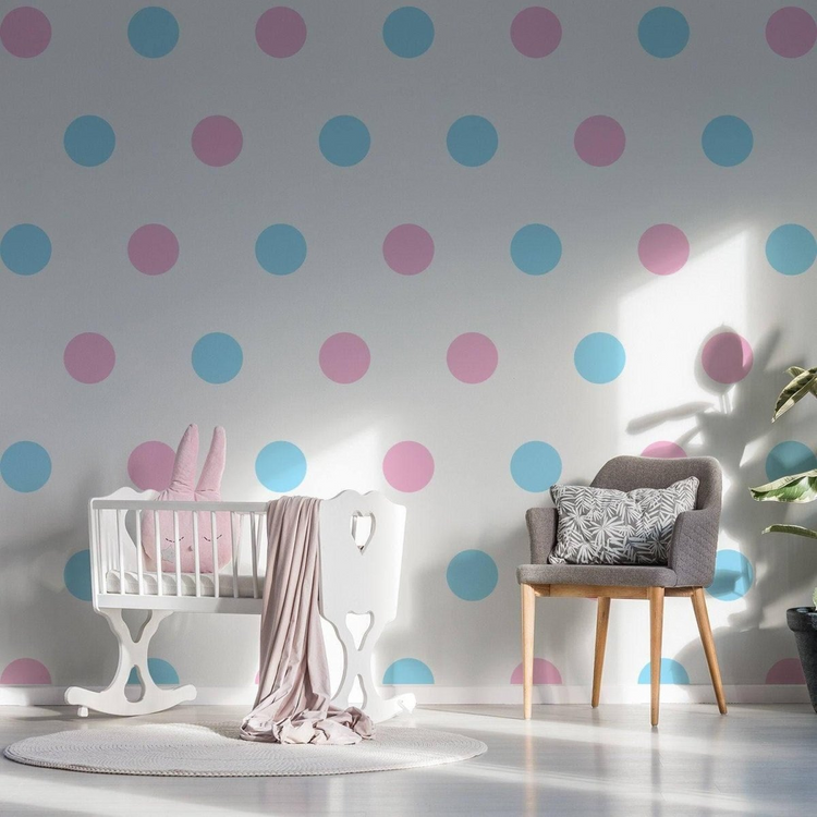 a baby room with a crib and chair