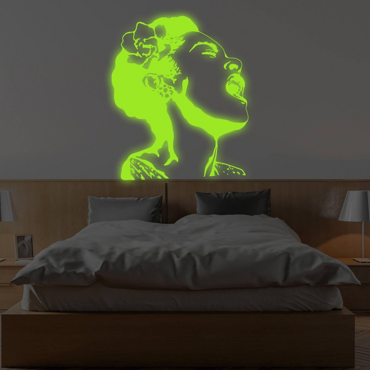 a wall with a glowing woman on the wall