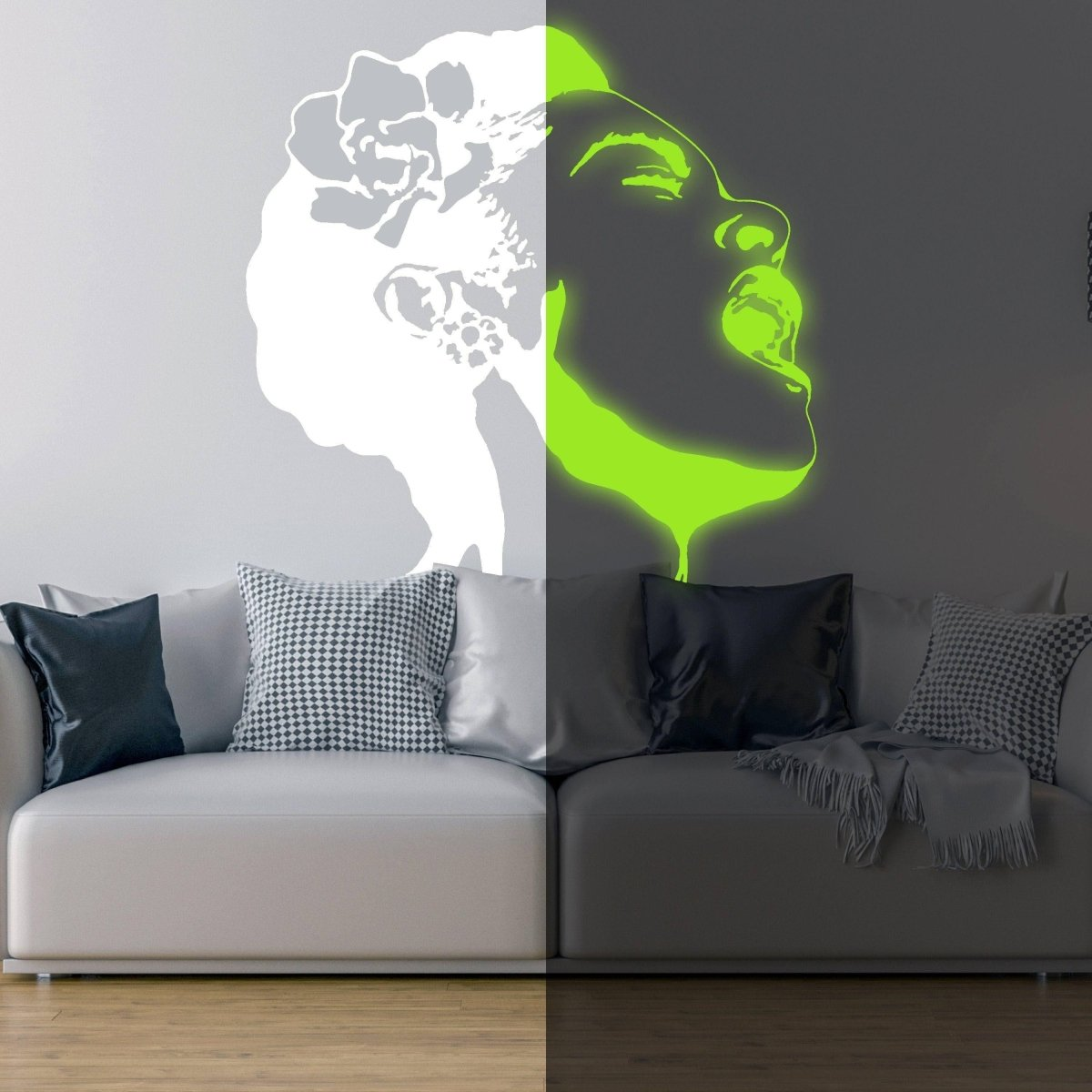 a white couch with a green glow in the dark face on the wall