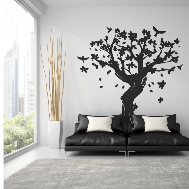 a couch and a tree wall decal