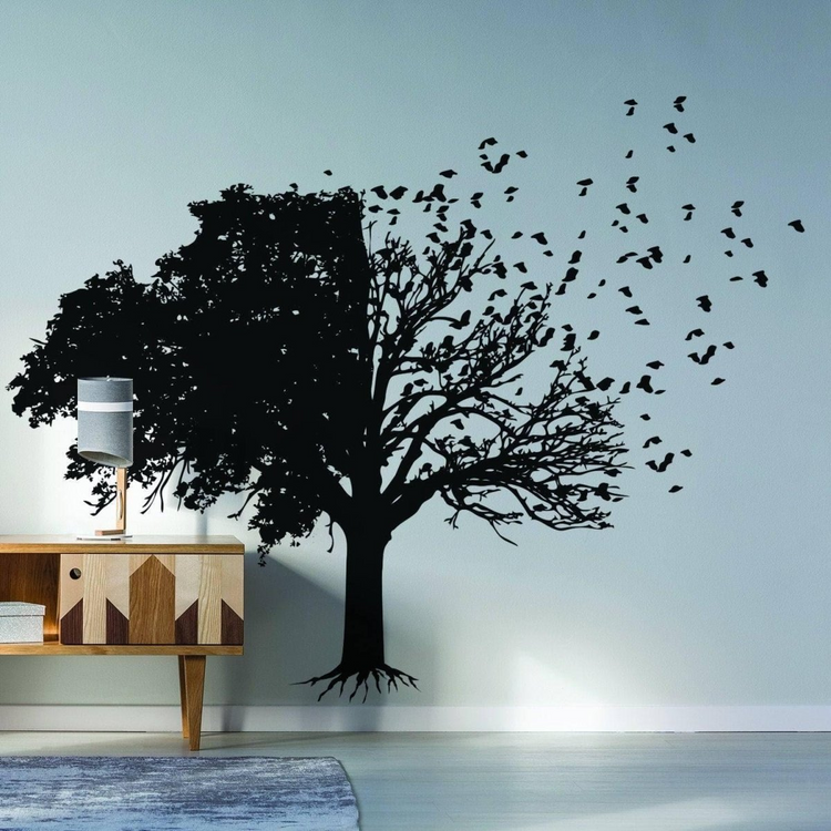 a tree with birds on the wall