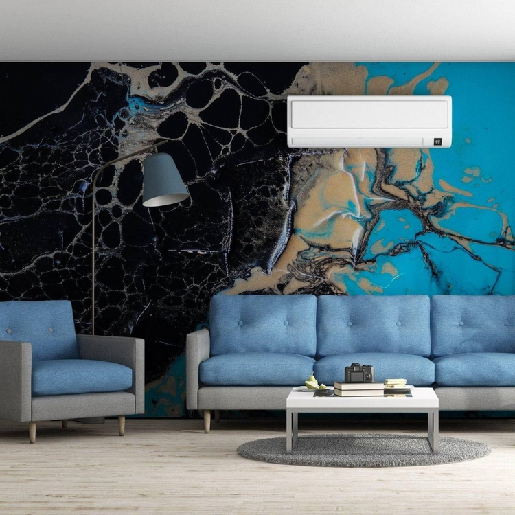 a room with a blue and black wall and a couch and a coffee table