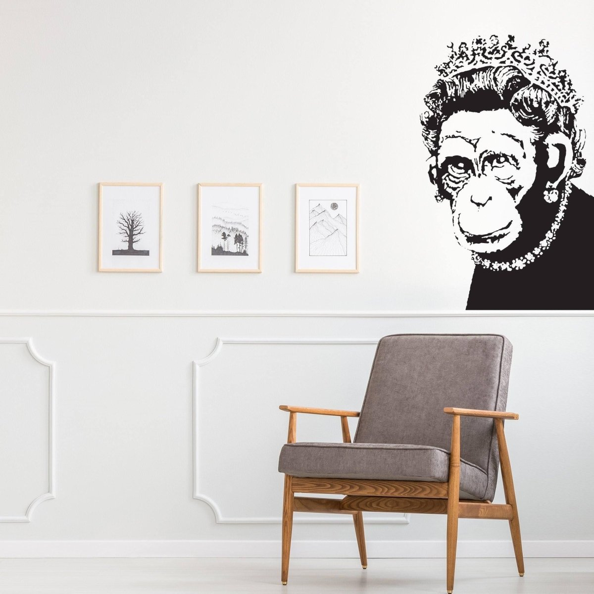 a chair in a room with a picture of a monkey
