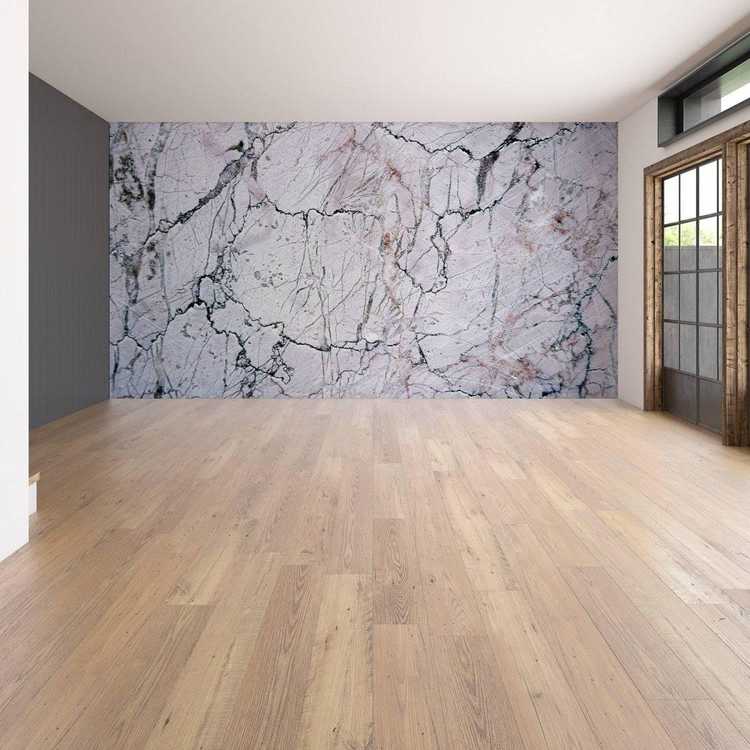 a room with a marble wall and wood floors