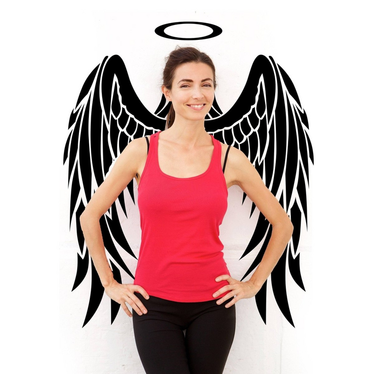 a woman standing in front of a wall with wings