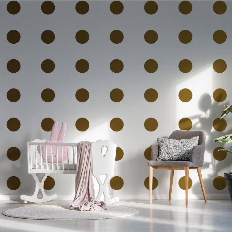 a baby room with a crib and chair