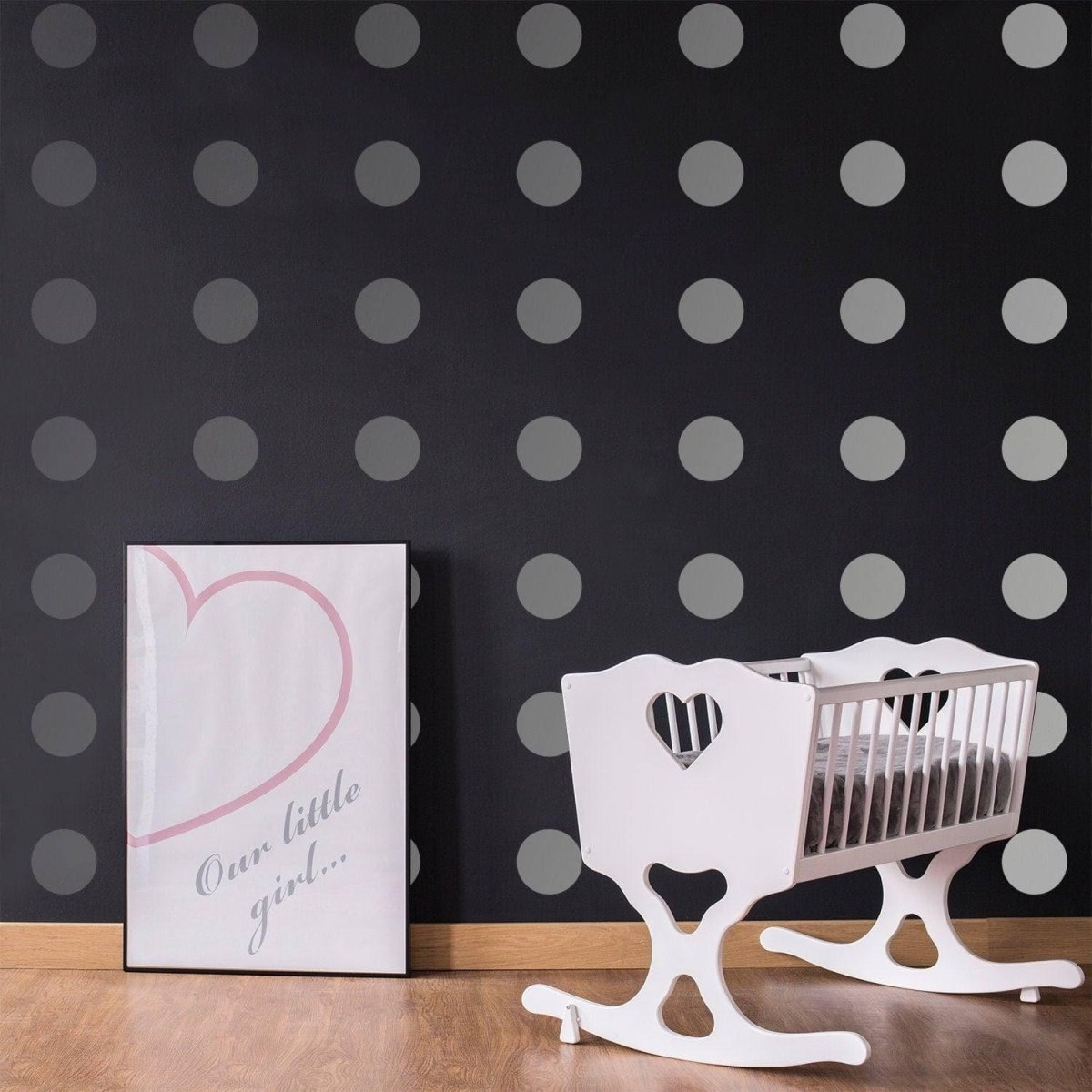 a baby crib next to a poster