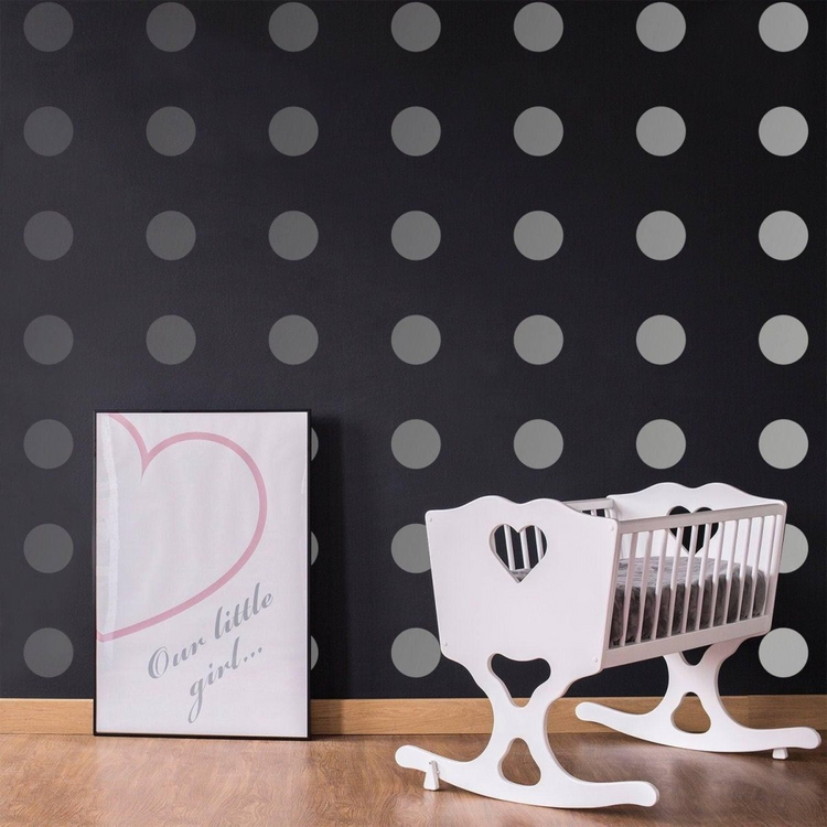 a baby crib next to a poster