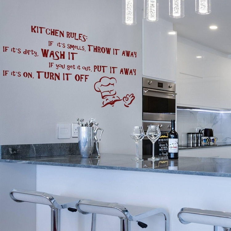 a kitchen with a bar and a bottle of wine