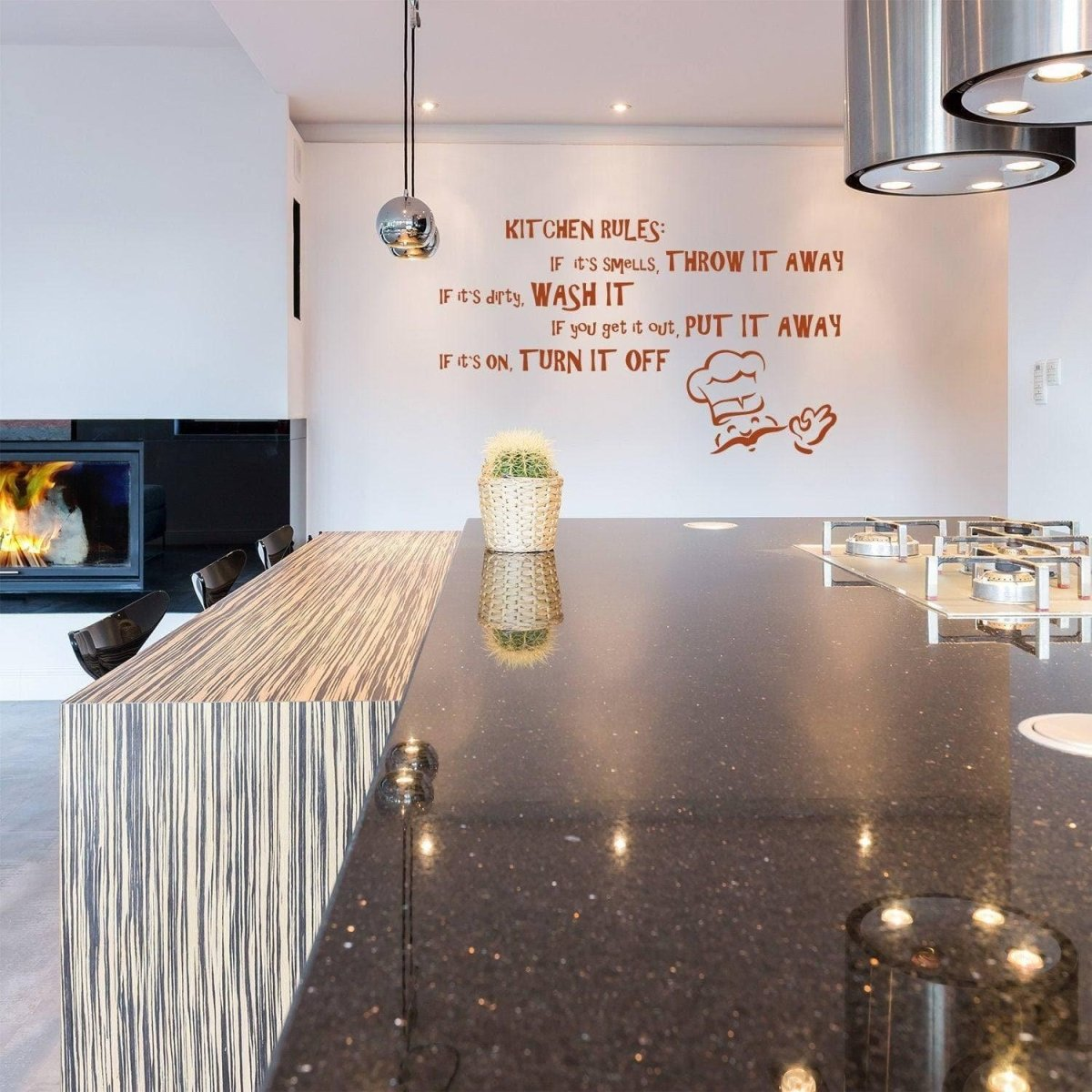 a kitchen with a fireplace and a black countertop